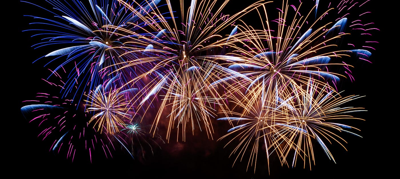 Fireworks bursting against a night sky