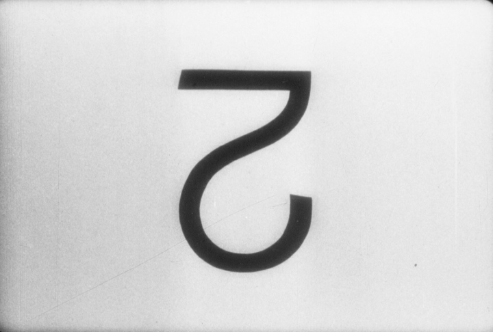 Single film frame showing a reversed number 2 from a countdown leader